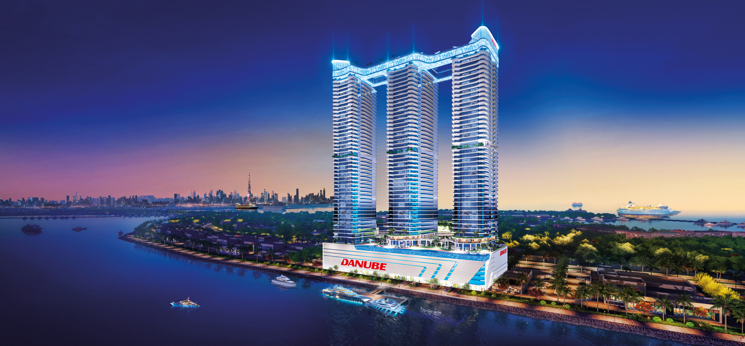 Illuminated Oceanz 3 towers on the Dubai Maritime City waterfront