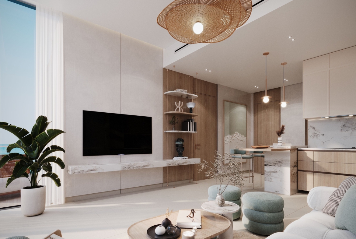 Living room and open kitchen in a One RAK Central apartment