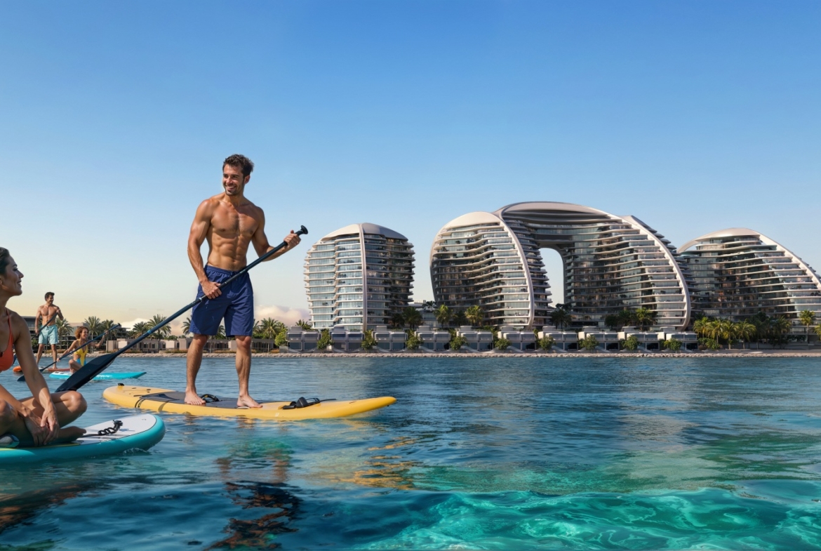 Paddleboarding with Oystra residences on the Al Marjan Island waterfront