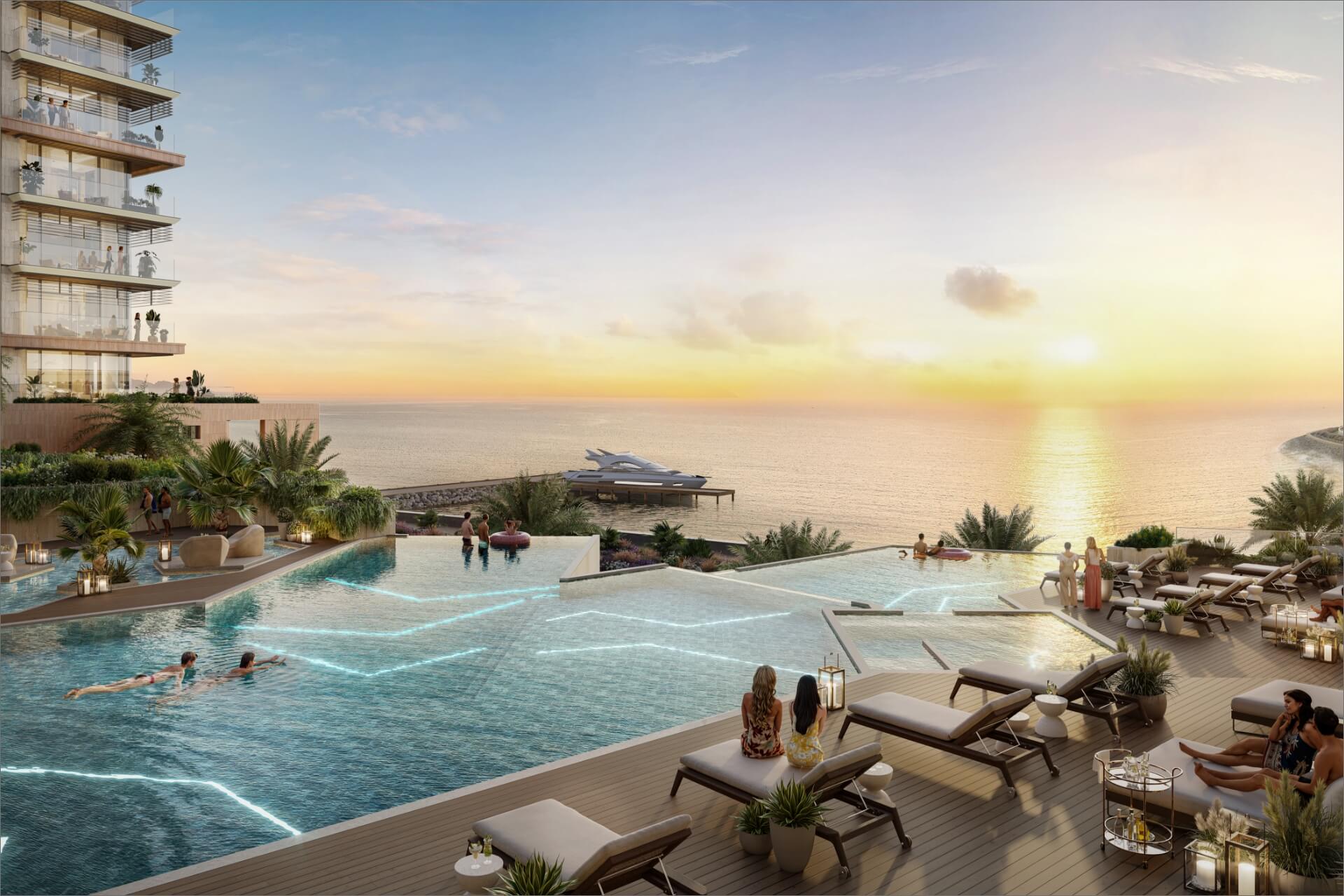 Infinity pool terrace at Playa Del Sol overlooking the Arabian Gulf at sunset