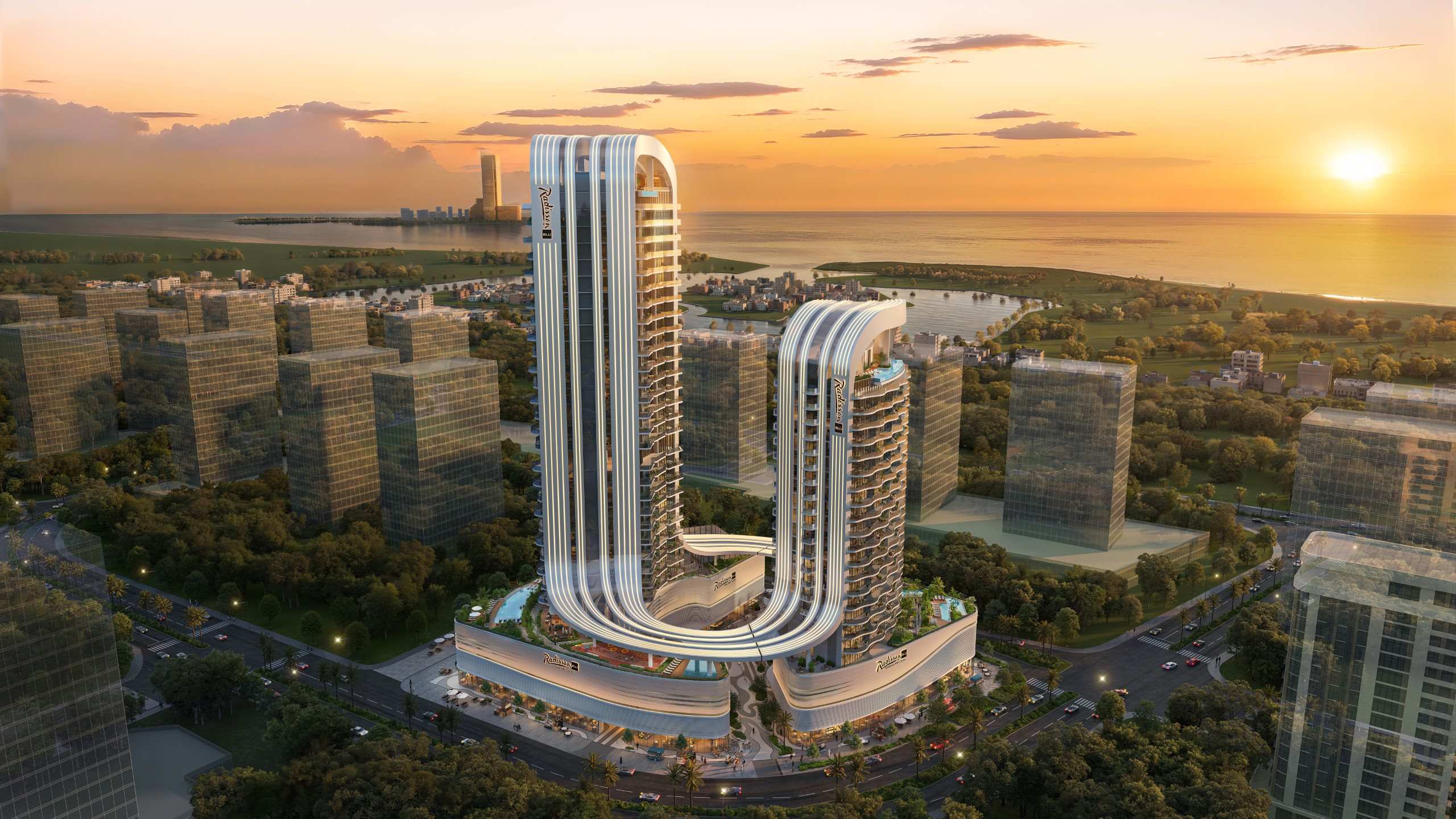 Radisson Blu Residences RAK Central sunset aerial Sunset aerial render of Radisson Blu Residences at RAK Central