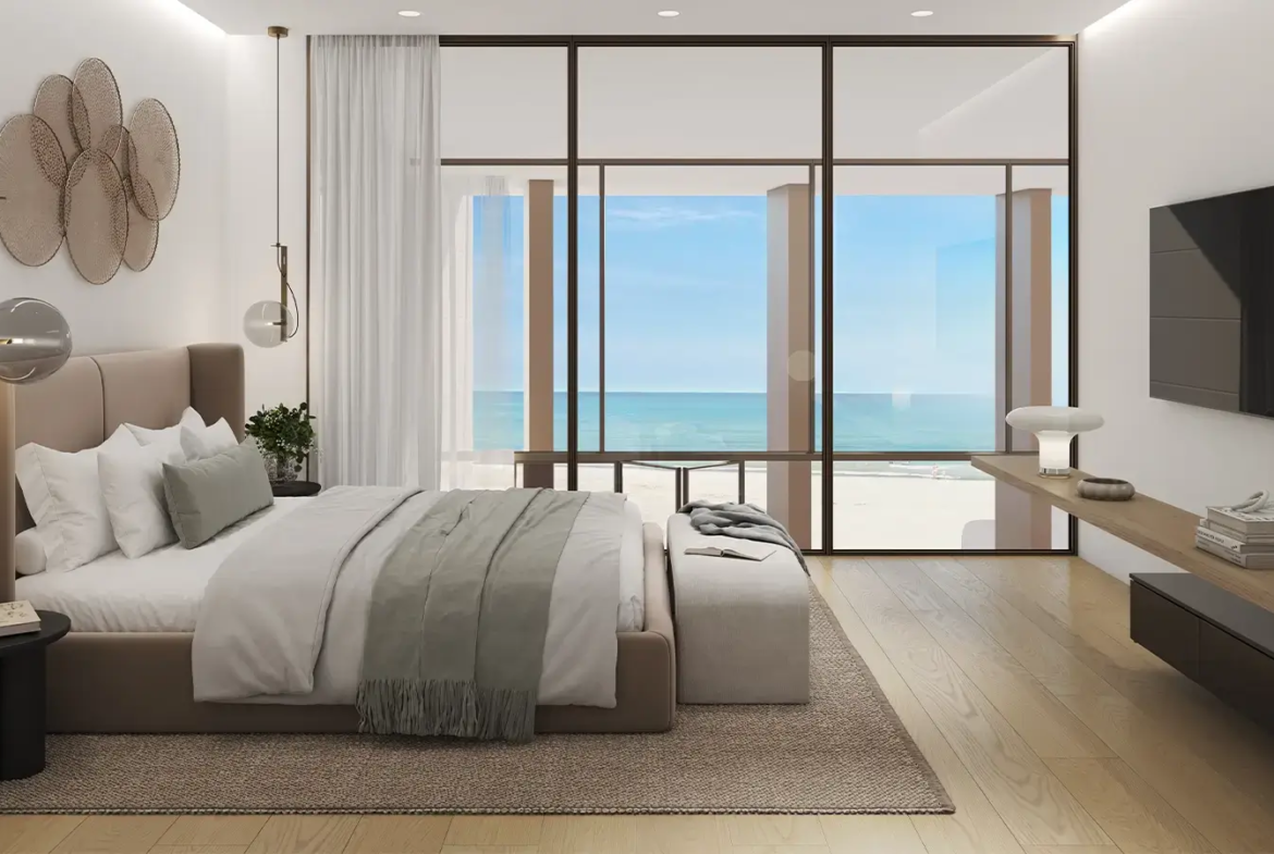Bedroom with Arabian Gulf view at Beach House at Bay Residences